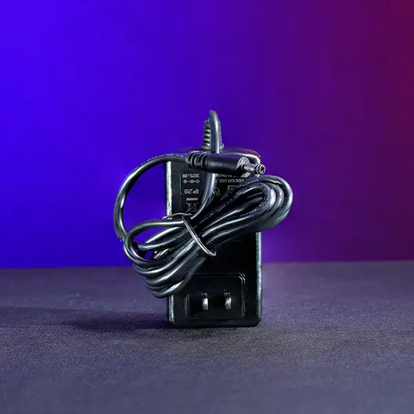 Economical 24V DC replacement wall charger for Astera Titan Tube and Helios Tube fixtures with 5.5mm x 2.1mm barrel connector. SKU: AST-FP1-CHR-ECO