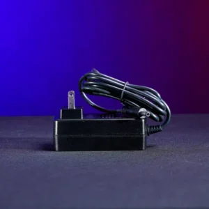 Economical 24V DC replacement wall charger for Astera Titan Tube and Helios Tube fixtures with 5.5mm x 2.1mm barrel connector. SKU: AST-FP1-CHR-ECO