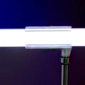 Universal tube light clamp with clear polycarbonate jaws, non-marring grip surfaces, and integrated 5/8-inch baby pin. SKU: TUBECLAMP